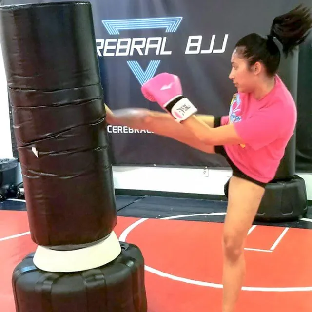Women practicing self-defense techniques in a women's self defense class at Aces Jiu Jitsu Club