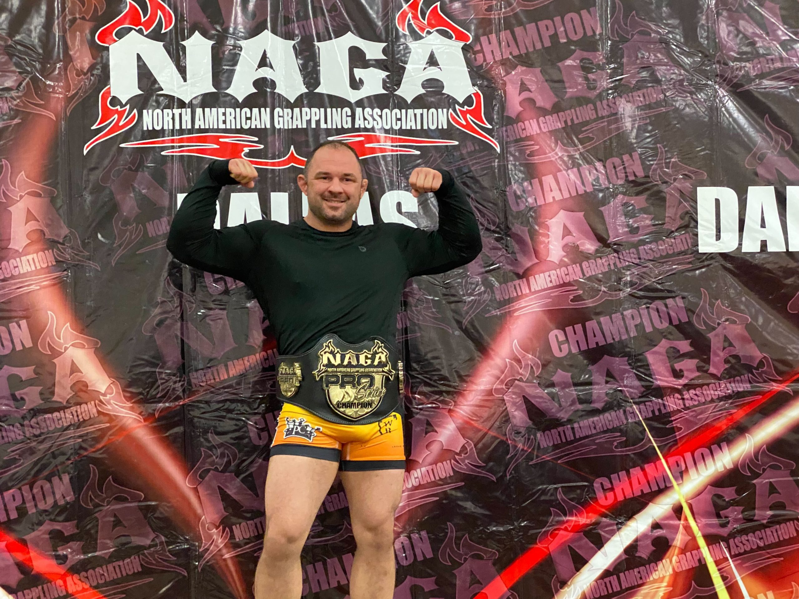 Professor Charley of Aces BJJ Club wins the NAGA Dallas Belt